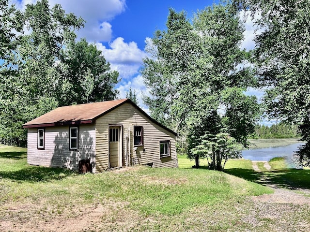 8931 Palm Rd, Britt, MN 55710 - rear view of property with a lawn and a water view