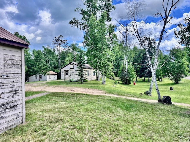 8931 Palm Rd, Britt, MN 55710 - view of grassy yard featuring driveway