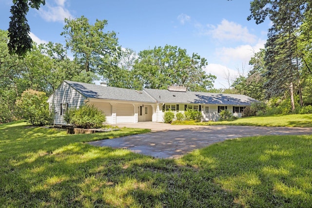 33 Eagle Ridge Rd, North Oaks, MN 55127 - ranch-style home featuring a garage, driveway, a front yard, and a chimney