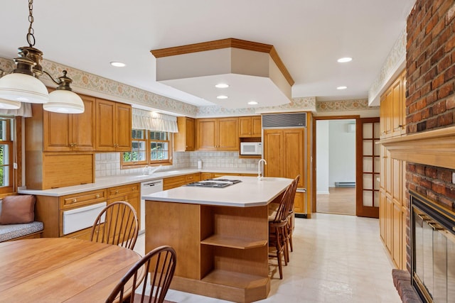 33 Eagle Ridge Rd, North Oaks, MN 55127 - kitchen featuring a warming drawer, white appliances, light countertops, decorative backsplash, and a kitchen island with sink