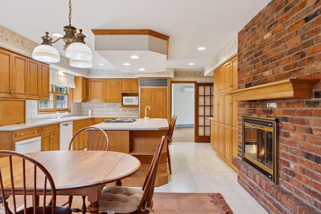 33 Eagle Ridge Rd, North Oaks, MN 55127 - kitchen featuring white appliances, light countertops, a brick fireplace, recessed lighting, and brown cabinetry