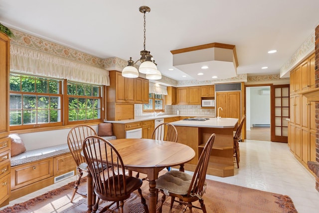 33 Eagle Ridge Rd, North Oaks, MN 55127 - dining area with a baseboard radiator, recessed lighting, and a chandelier