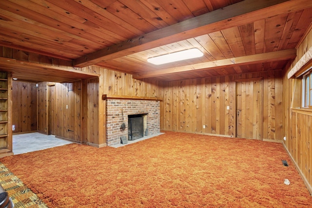 33 Eagle Ridge Rd, North Oaks, MN 55127 - unfurnished living room featuring a wooden ceiling with exposed beams, wooden walls, a fireplace, and carpet floors
