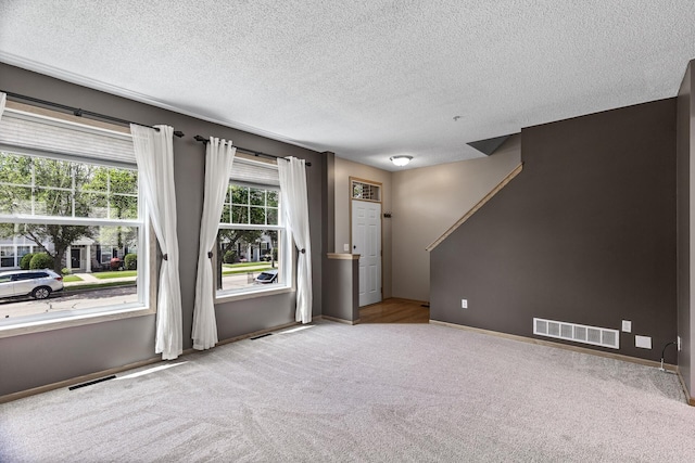 2079 Clover Ridge Dr, Chaska, MN 55318 - unfurnished room featuring carpet floors, a textured ceiling, and stairway