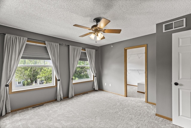 2079 Clover Ridge Dr, Chaska, MN 55318 - carpeted empty room featuring ceiling fan and a textured ceiling