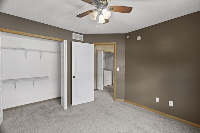 2079 Clover Ridge Dr, Chaska, MN 55318 - unfurnished bedroom featuring washer / dryer, carpet, a closet, ceiling fan, and a textured ceiling