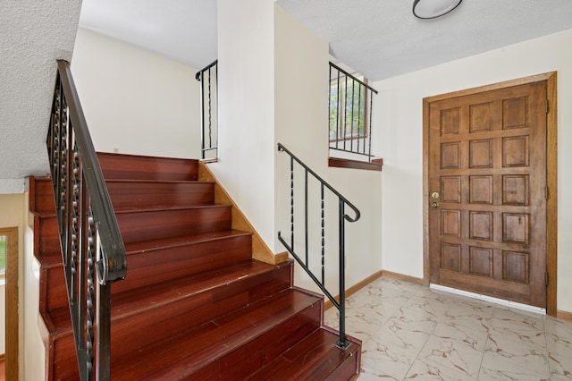 629 73rd Way N, Brooklyn Park, MN 55444 - foyer entrance featuring marble finish floors and stairs