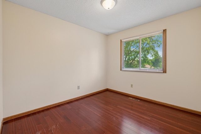 629 73rd Way N, Brooklyn Park, MN 55444 - unfurnished room with hardwood / wood-style flooring and baseboards