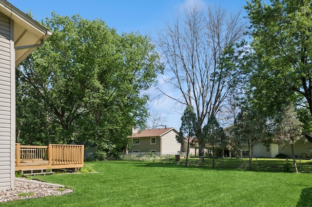 629 73rd Way N, Brooklyn Park, MN 55444 - view of yard featuring a deck