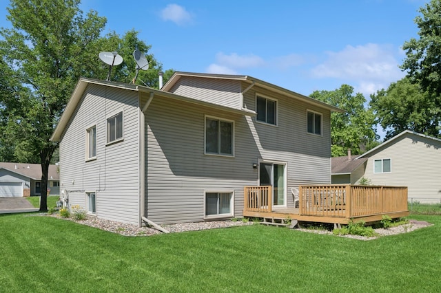 629 73rd Way N, Brooklyn Park, MN 55444 - rear view of house with a lawn and a wooden deck