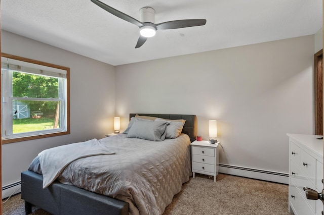 17220 138th Ave N, Dayton, MN 55327 - bedroom with baseboard heating, light colored carpet, and ceiling fan