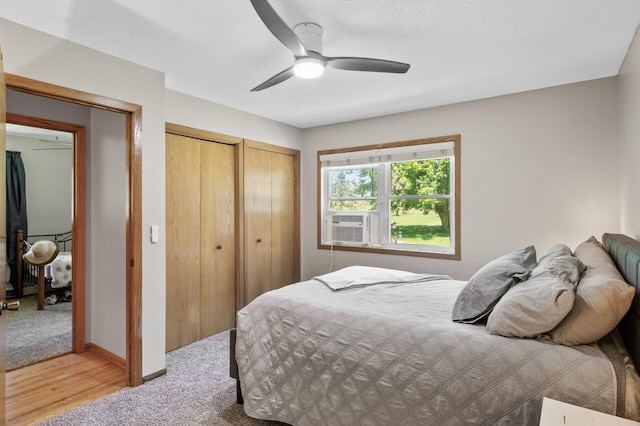 17220 138th Ave N, Dayton, MN 55327 - bedroom with multiple closets, ceiling fan, cooling unit, and light colored carpet