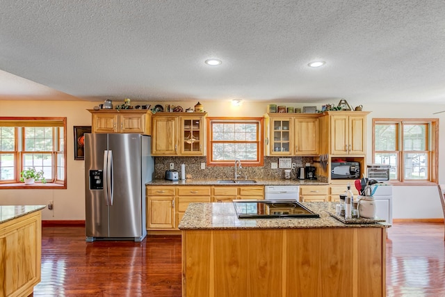 W1162 Aspen Dr, Spring Valley, WI 54767 - kitchen featuring stainless steel fridge with ice dispenser, a textured ceiling, dark wood finished floors, stovetop, and healthy amount of natural light