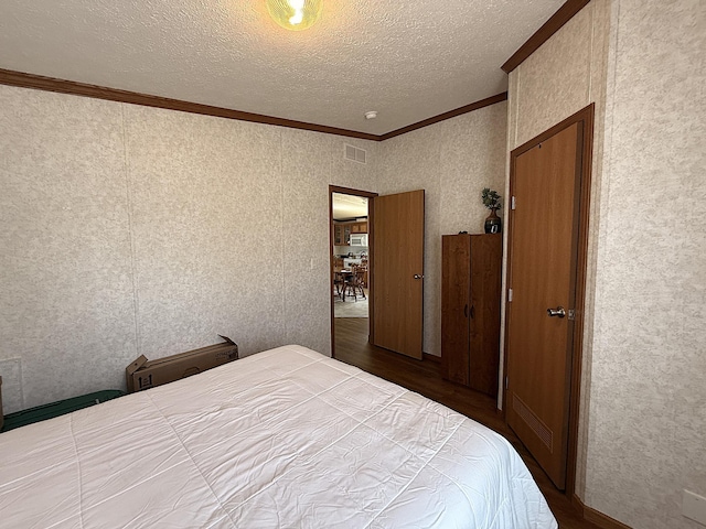 151 Skyline Dr, Granite Falls, MN 56241 - bedroom featuring crown molding, wood finished floors, and a textured ceiling
