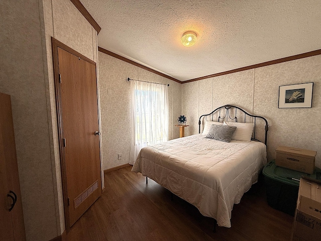 151 Skyline Dr, Granite Falls, MN 56241 - bedroom with crown molding, wood finished floors, vaulted ceiling, and a textured ceiling