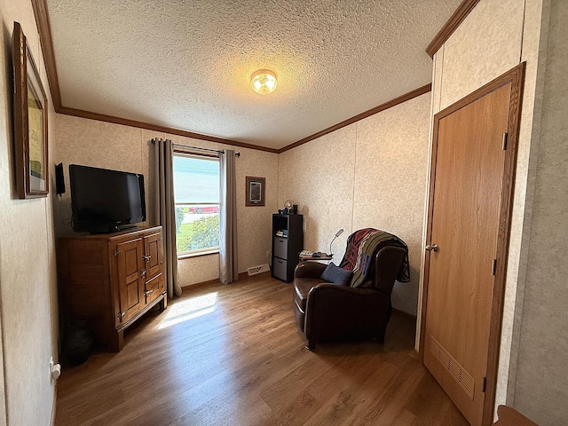 151 Skyline Dr, Granite Falls, MN 56241 - living area with crown molding, wood finished floors, a textured ceiling, and lofted ceiling
