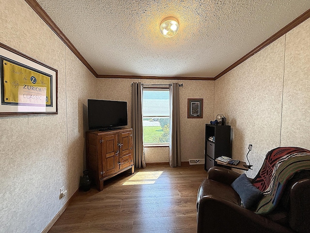 151 Skyline Dr, Granite Falls, MN 56241 - living area featuring crown molding, a textured ceiling, and wood finished floors