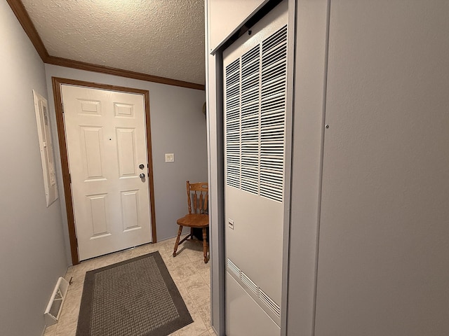 151 Skyline Dr, Granite Falls, MN 56241 - entryway with a heating unit, crown molding, and a textured ceiling