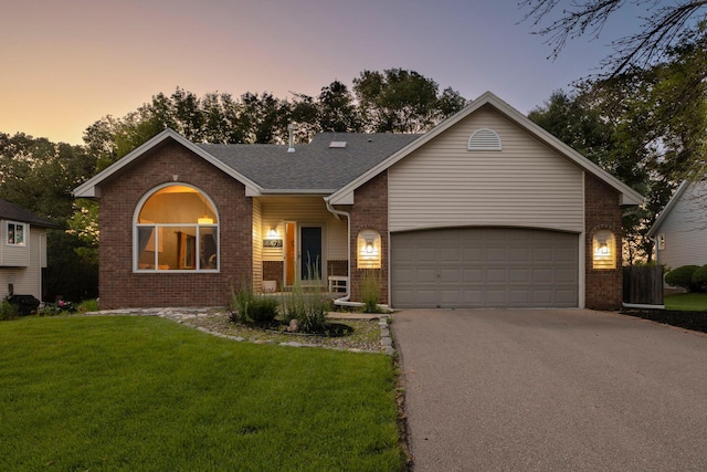 4478 150th St, Savage, MN 55378 - ranch-style home featuring brick siding, driveway, a yard, and a garage