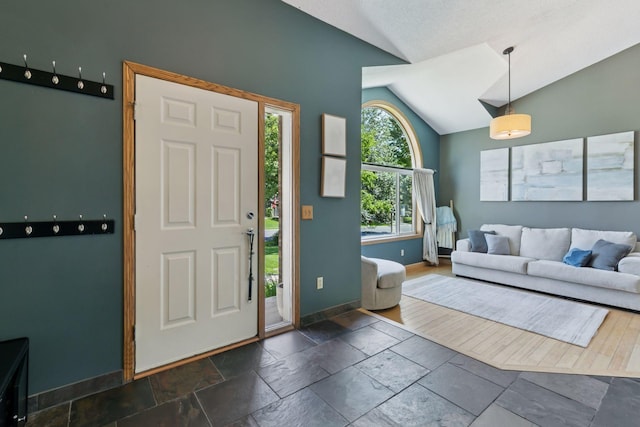 4478 150th St, Savage, MN 55378 - foyer entrance featuring lofted ceiling and stone tile floors