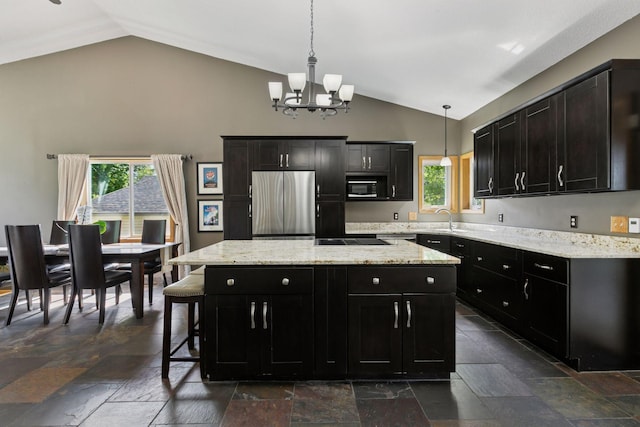 4478 150th St, Savage, MN 55378 - kitchen with black appliances, stone tile flooring, a chandelier, dark cabinets, and a center island