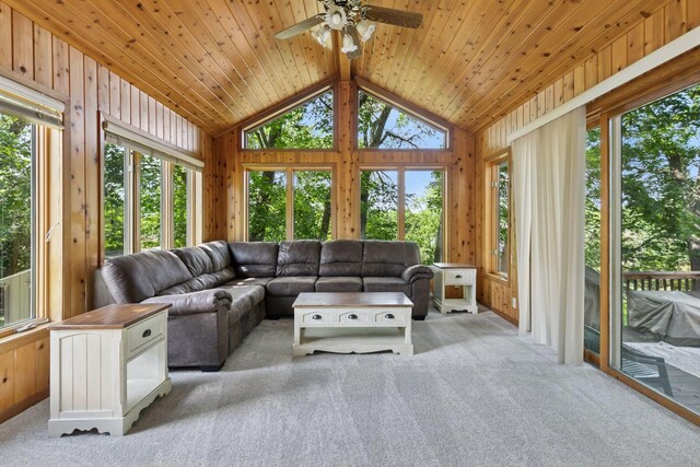 4478 150th St, Savage, MN 55378 - living room with lofted ceiling, a ceiling fan, wood walls, plenty of natural light, and light colored carpet