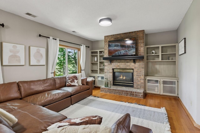 4478 150th St, Savage, MN 55378 - living area with wood finished floors and a fireplace
