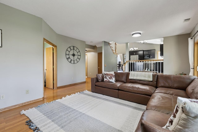 4478 150th St, Savage, MN 55378 - living room featuring light wood finished floors and a chandelier