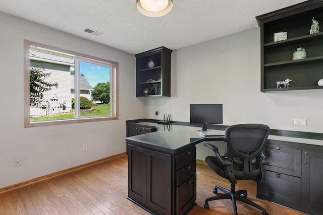 4478 150th St, Savage, MN 55378 - office space with light wood-style floors and a textured ceiling