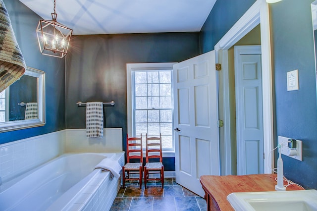 16735 Downey Dr, Park Rapids, MN 56470 - bathroom featuring a garden tub, vanity, and a chandelier