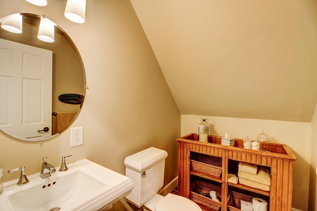 16735 Downey Dr, Park Rapids, MN 56470 - half bathroom featuring a sink and lofted ceiling
