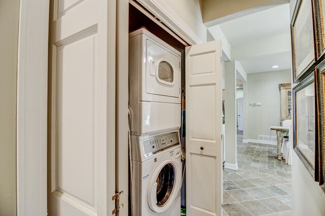 16735 Downey Dr, Park Rapids, MN 56470 - washroom with stacked washer / dryer and baseboards