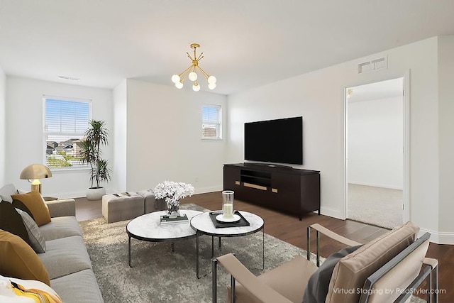 3618 112th Cir NE, Blaine, MN 55449 - living area with plenty of natural light, wood finished floors, and a chandelier