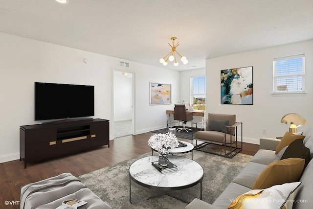 3618 112th Cir NE, Blaine, MN 55449 - living area with a chandelier, plenty of natural light, and wood finished floors