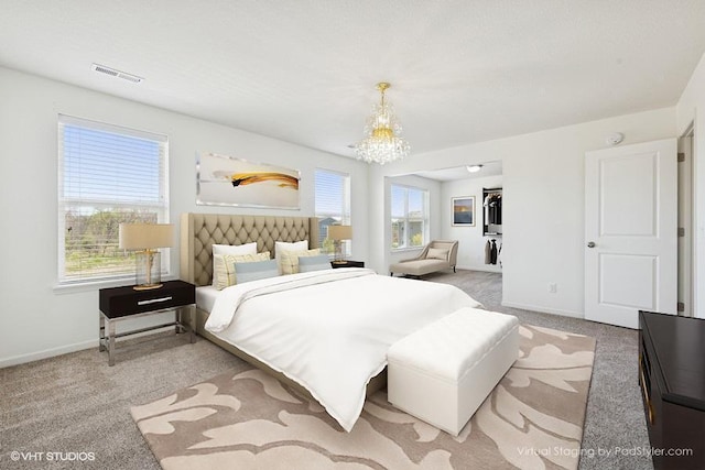 3618 112th Cir NE, Blaine, MN 55449 - carpeted bedroom featuring a chandelier and a spacious closet
