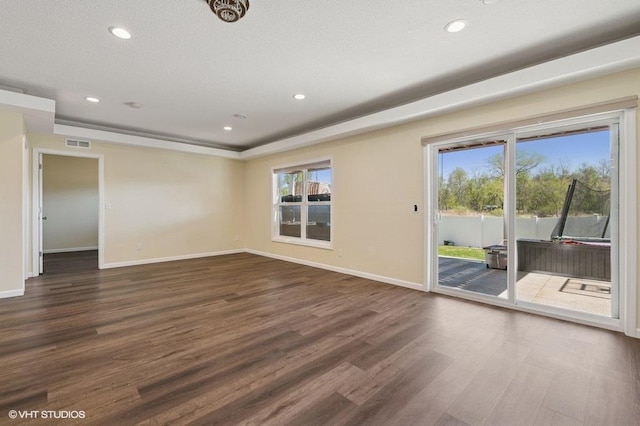 3618 112th Cir NE, Blaine, MN 55449 - empty room featuring dark wood-style flooring, recessed lighting, and a tray ceiling