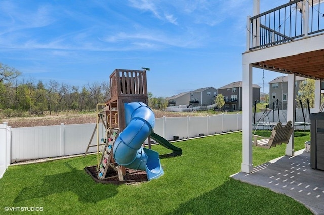 3618 112th Cir NE, Blaine, MN 55449 - view of play area with a fenced backyard, a trampoline, a residential view, and a patio area