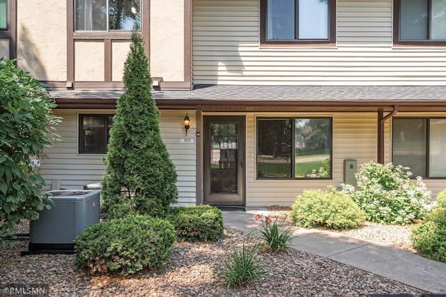 1111 Royal Oaks Dr, Shoreview, MN 55126 - doorway to property featuring a shingled roof