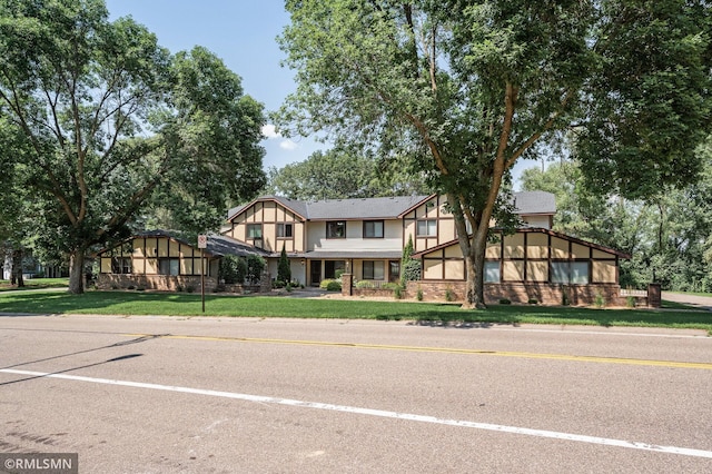1111 Royal Oaks Dr, Shoreview, MN 55126 - tudor home featuring a front yard