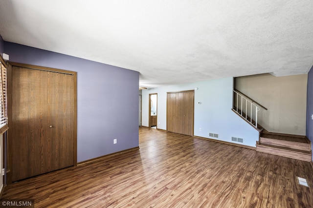1111 Royal Oaks Dr, Shoreview, MN 55126 - unfurnished living room featuring wood finished floors and stairs