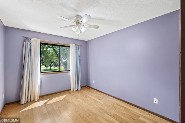 1111 Royal Oaks Dr, Shoreview, MN 55126 - unfurnished room with light wood-type flooring, ceiling fan, and a textured ceiling