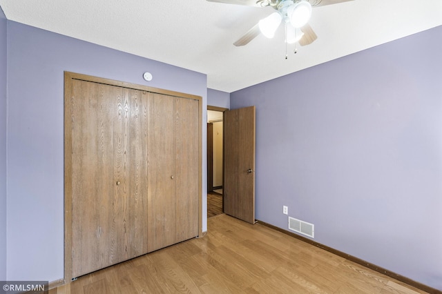 1111 Royal Oaks Dr, Shoreview, MN 55126 - unfurnished bedroom with wood finished floors, a closet, and ceiling fan