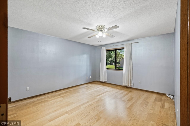 1111 Royal Oaks Dr, Shoreview, MN 55126 - empty room featuring wood finished floors, a ceiling fan, and a textured ceiling