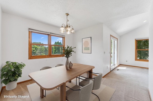 5071 Arrowood Ln N, Plymouth, MN 55442 - dining space featuring healthy amount of natural light, light carpet, a chandelier, and a textured ceiling