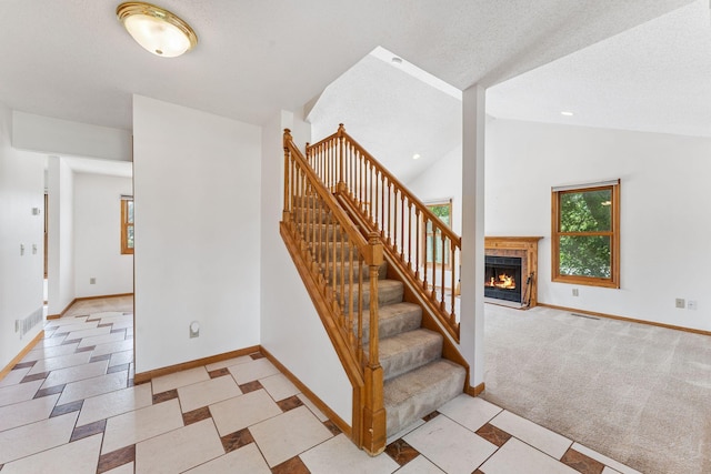 5071 Arrowood Ln N, Plymouth, MN 55442 - stairway featuring a fireplace and vaulted ceiling