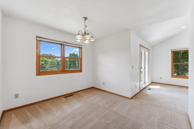 5071 Arrowood Ln N, Plymouth, MN 55442 - empty room with plenty of natural light, a chandelier, light carpet, and a textured ceiling