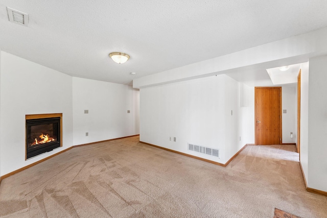 5071 Arrowood Ln N, Plymouth, MN 55442 - unfurnished living room with carpet flooring, a glass covered fireplace, and a textured ceiling