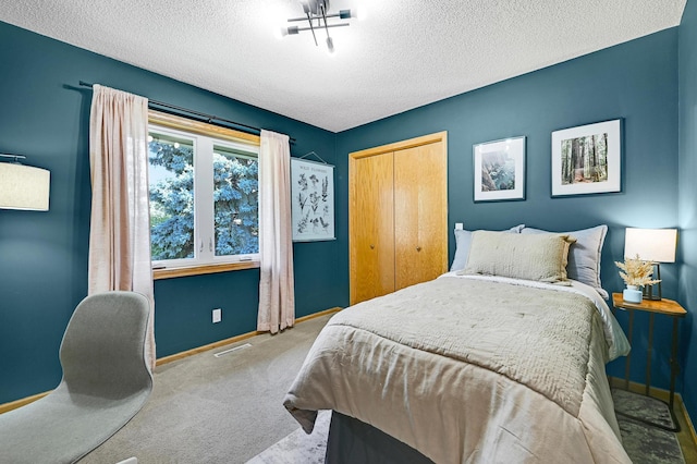 7111 Trenton Ln N, Maple Grove, MN 55369 - carpeted bedroom featuring a textured ceiling and a closet