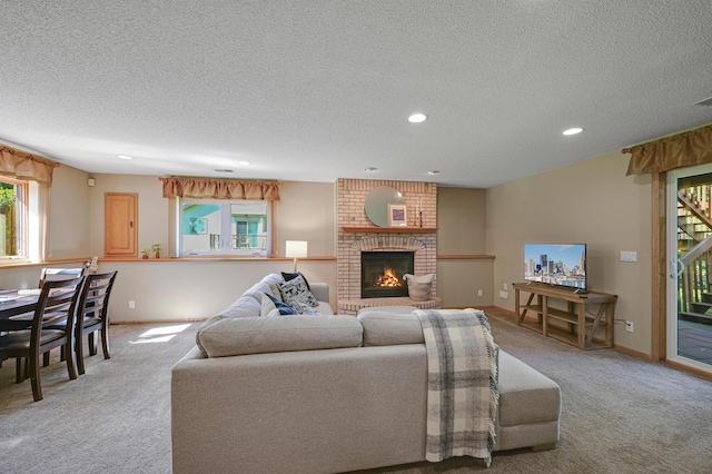 7111 Trenton Ln N, Maple Grove, MN 55369 - living room featuring carpet flooring, a textured ceiling, a fireplace, and recessed lighting