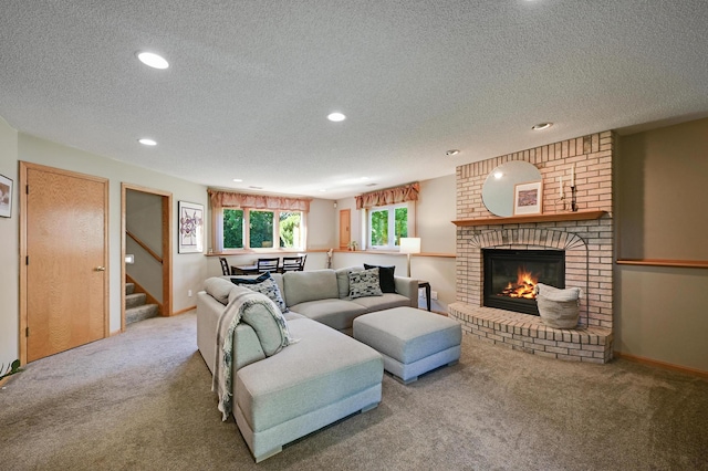 7111 Trenton Ln N, Maple Grove, MN 55369 - carpeted living room with a textured ceiling, recessed lighting, stairs, and a brick fireplace